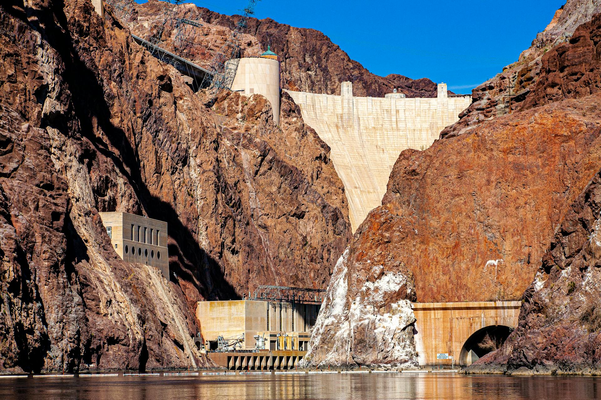 Hoover Dam surrounded by red rock cliffs