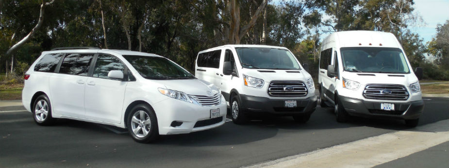 3 Vans Parked Outside